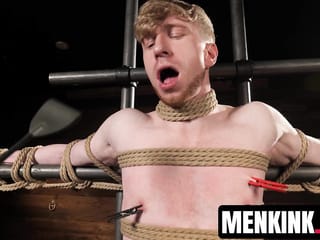 Kyler Drake makes Jesse Stone bite a gag as he drips hot wax over him