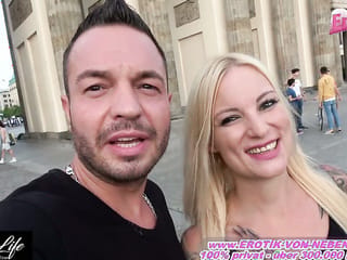Bold Lovers Engage in Risky Public Passion at the Brandenburg Gate